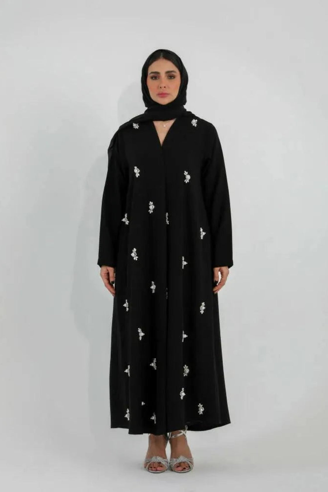 Black Luluwa abaya in soft crepe with hand-embroidered pearl-inspired details and a simple straight cut.
