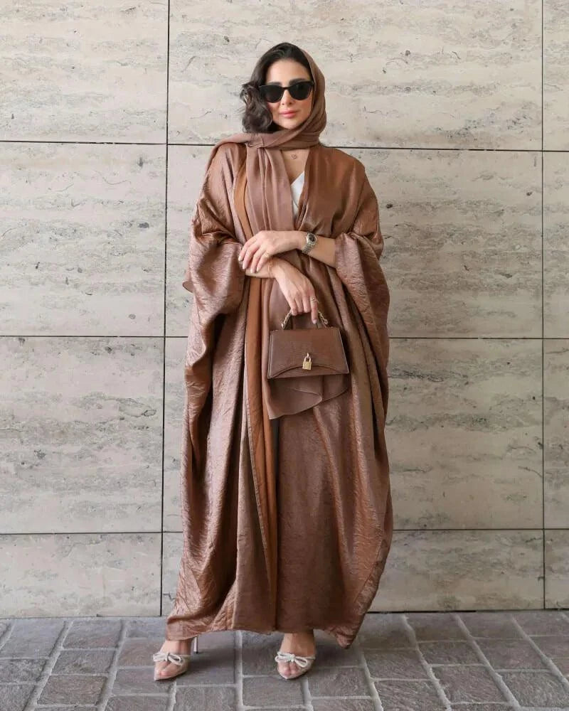 freesize abaya in shimmering brown silk with soft flowing drape and subtle shine worn with matching hijab and handbag