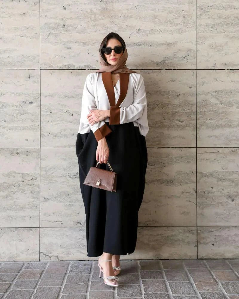 Stylish freesize blazer in three-tone crepe fabric worn with black skirt and brown handbag