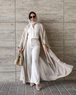 Silka luxurious freesize beige silk abaya with flowing silhouette and soft texture modeled outdoors