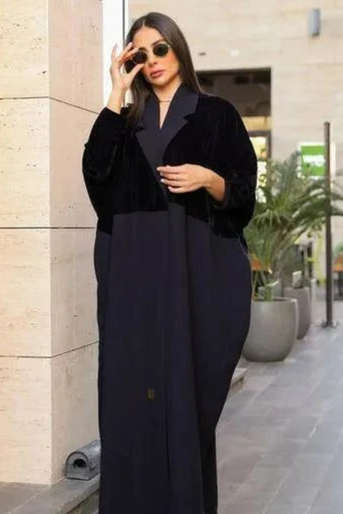 Woman wearing navy blue freesize blazer with velvet and crepe fabric mix, styled with sunglasses in an outdoor urban setting
