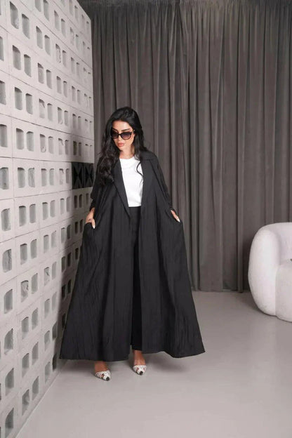 Woman wearing a free-size black linen blazer with wide fit and relaxed style indoors