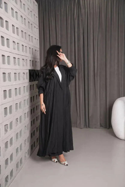 Woman wearing a free-size black linen blazer with wide fit and relaxed style indoors - free-size blazer
