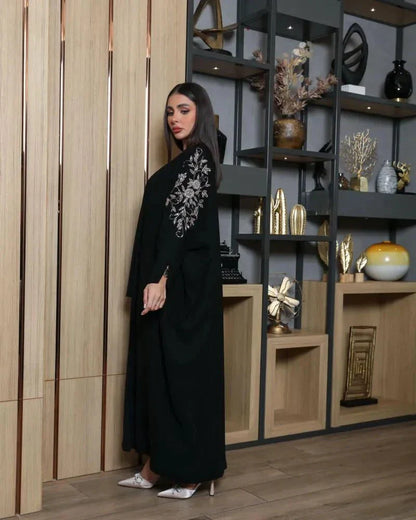 Black bisht with bronze hand embroidery on premium crepe fabric, loose fit for elegance and comfort.