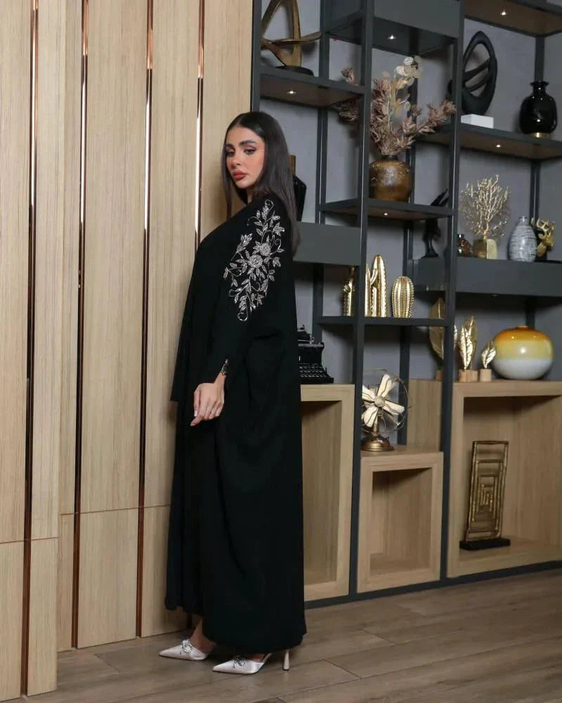 Black bisht with bronze hand embroidery on premium crepe fabric, loose fit for elegance and comfort.