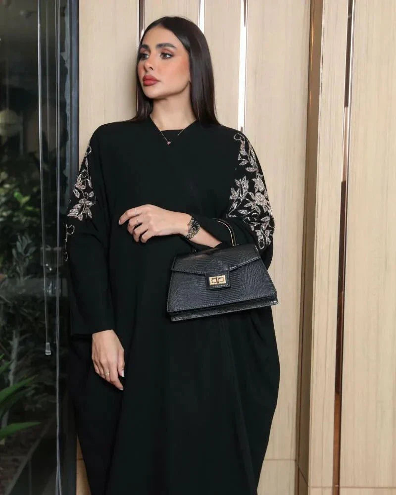 Black bisht with bronze hand embroidery on premium crepe fabric, loose fit for elegance and comfort.