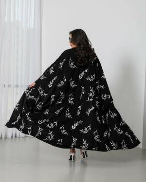 Bisht-style abaya in black with elegant white rose embroidery and varying lengths for a graceful look