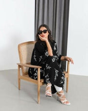 Bisht-style abaya in black with elegant white rose embroidery and varying lengths for a graceful look