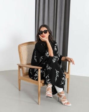 Bisht-style abaya in black with elegant white rose embroidery and varying lengths for a graceful look