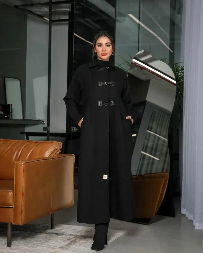 Harbor black abaya in structured wool with high-neck collar and three buckle closures for winter layering and side pockets