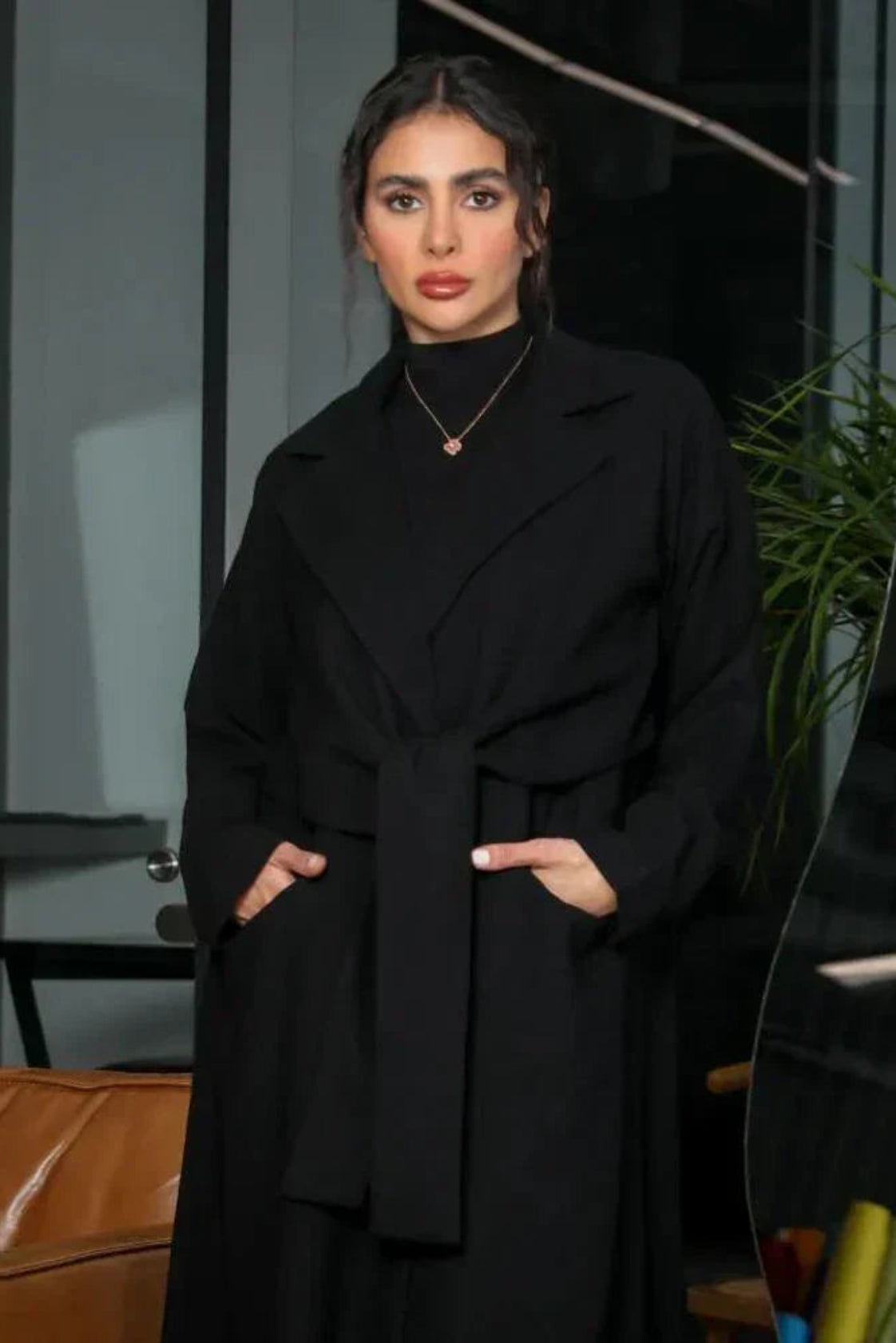 minimal black blazer-style abaya with lapel collar, full sleeves, and matching belt in smooth crepe fabric
