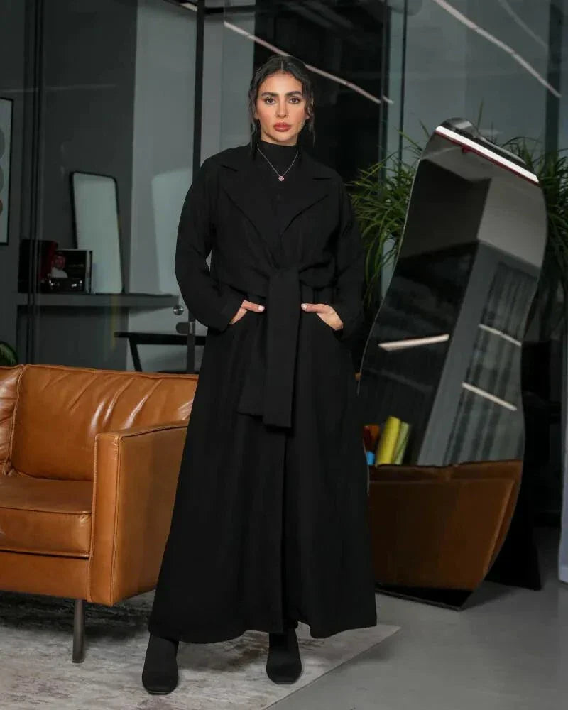minimal black blazer-style abaya with lapel collar, full sleeves, and matching belt in smooth crepe fabric