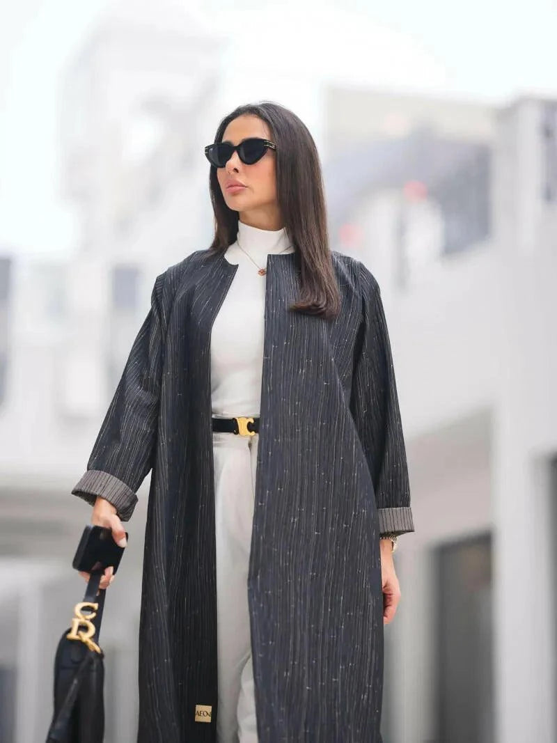 Elegant gray Jacquelin abaya with tonal jacquard lines, soft structured fabric, and modern minimalist flowy cut.