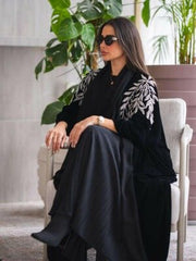 Elegant luxurious black velvet abaya with silver leaf embroidery on shoulders and sleeves