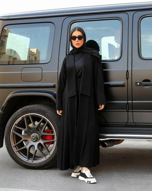 Flowline modern black crepe abaya with blazer-style top, gathered wide pleats, hood, and casual tailored design
