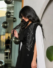 black crepe abaya with white pleated side panels and silver bead embroidery in a leaf pattern
