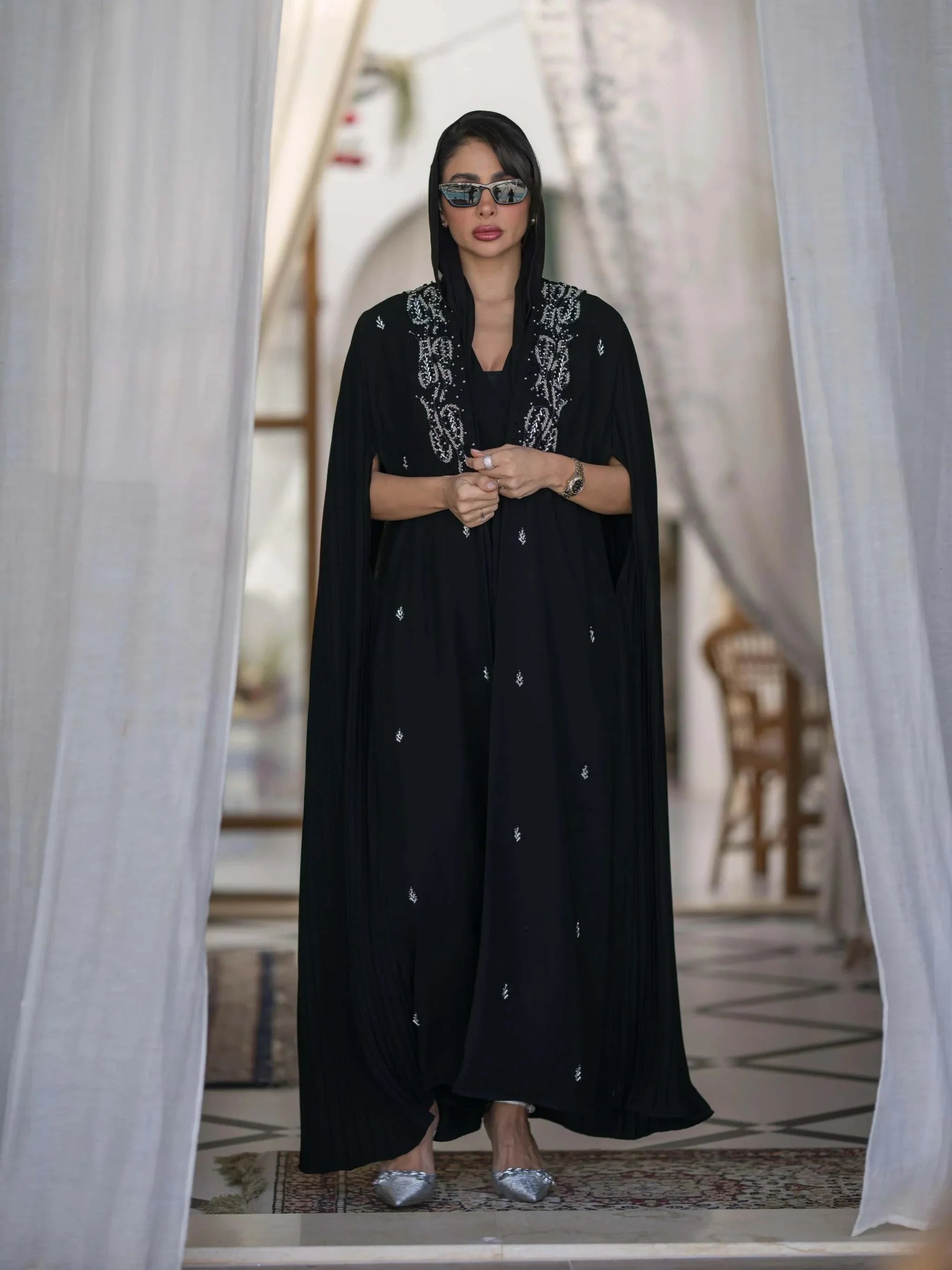 Elegant black abaya with silver embroidery and pleated cape sleeves for special occasions