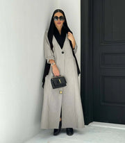 Modern gray crepe abaya with black collar, single button, and relaxed sleeves, styled with black hijab and handbag - Shadow Blend