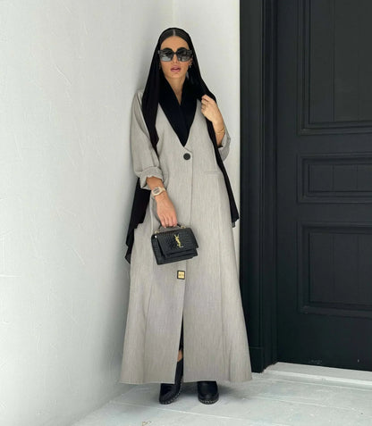 Modern gray crepe abaya with black collar, single button, and relaxed sleeves, styled with black hijab and handbag - Shadow Blend
