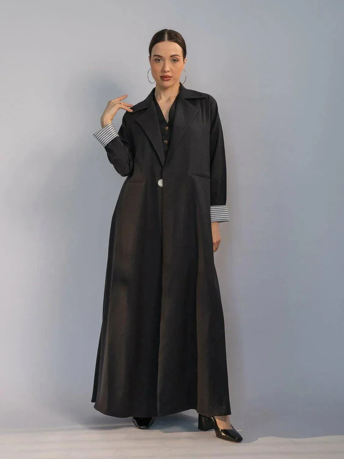 elegant black crepe abaya with structured collar, hidden buttons, and padded striped cuffs for modern chic look - black crepe abaya