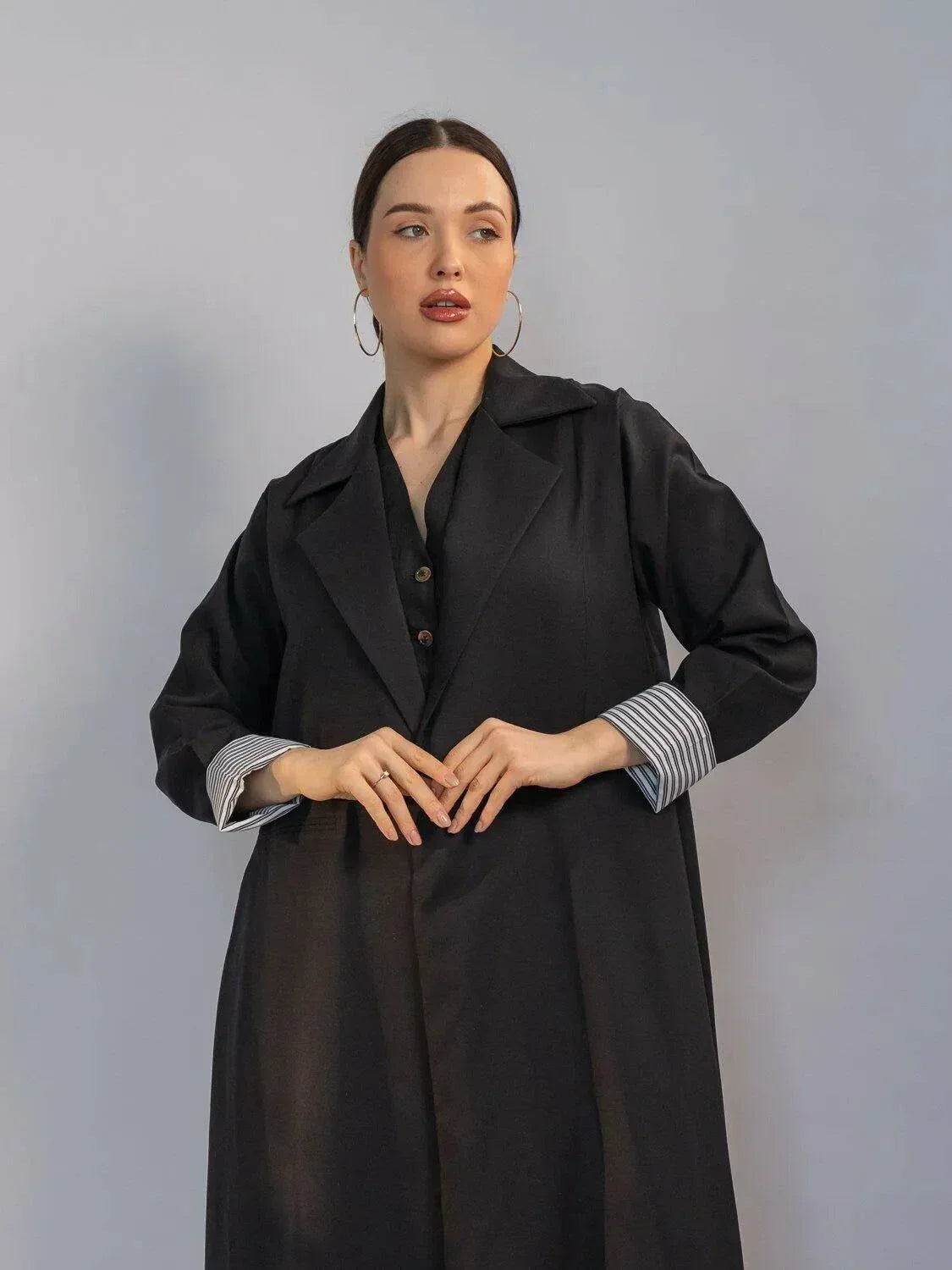 elegant black crepe abaya with structured collar, hidden buttons, and padded striped cuffs for modern chic look - black crepe abaya