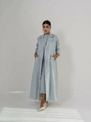 Full-length light blue linen coat with sharp lapel collar, double-breasted front, and side pockets, featuring a structured silhouette - full-length coat