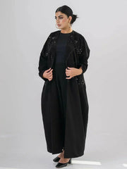 Elegant black abaya with intricate black-on-black embroidery and a soft open front design for modest, sophisticated wear