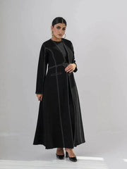 modern black crepe abaya with geometric contrast stitching and full-length silhouette
