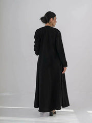 modern black crepe abaya with geometric contrast stitching and full-length silhouette