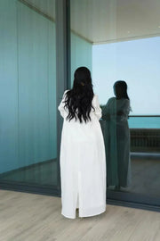 Elegant off-white linen blazer-style abaya with tailored cut and modern silhouette