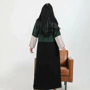 Color-blocked crepe blazer abaya with forest green body, black lapels, and grey sleeve cuffs over a flowy black base.