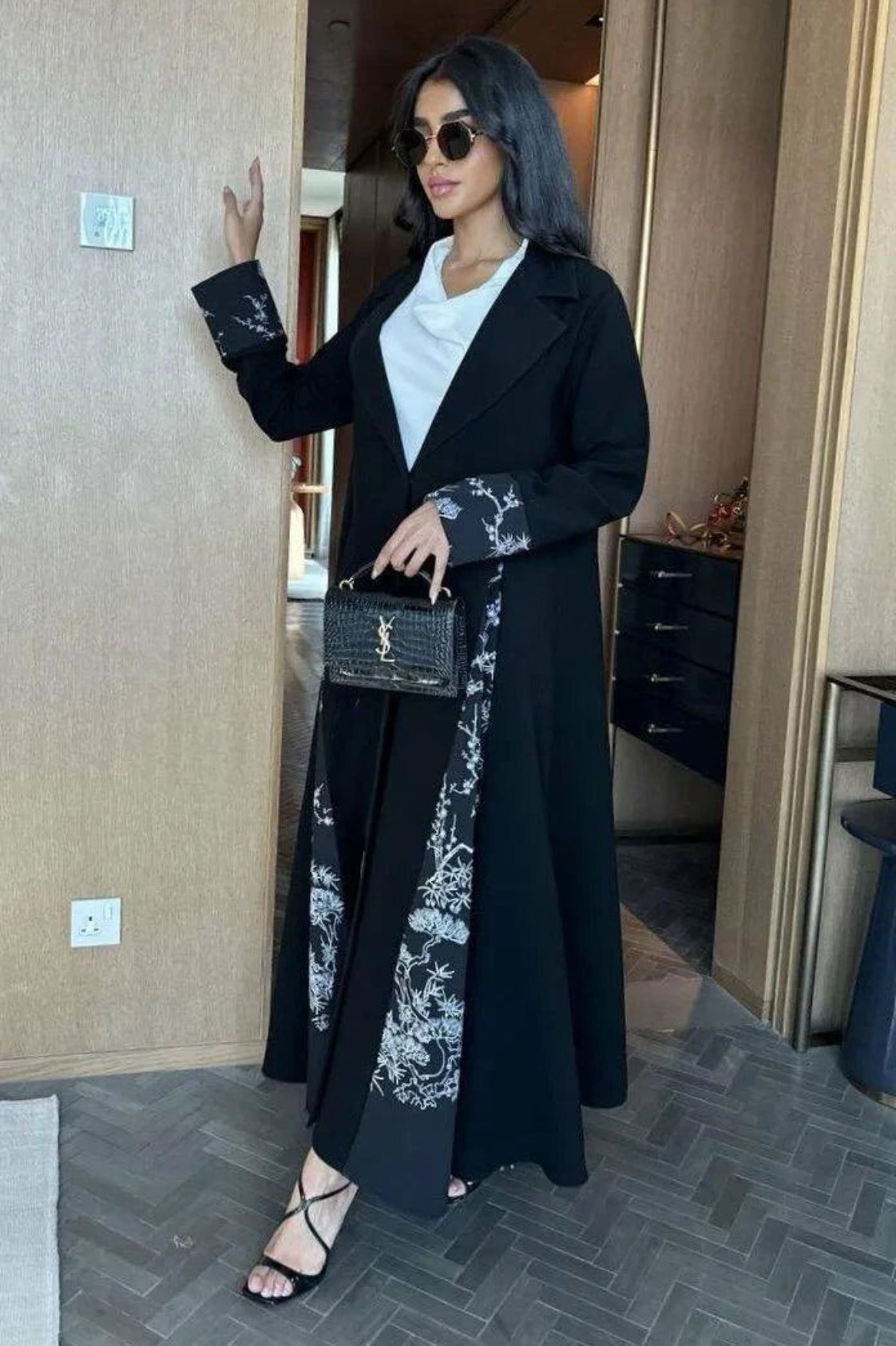 modern black abaya with white crepe fabric accents and minimalist color-block design