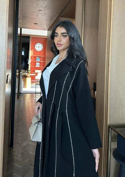Modern black abaya with white line detailing in soft crepe fabric for everyday wear