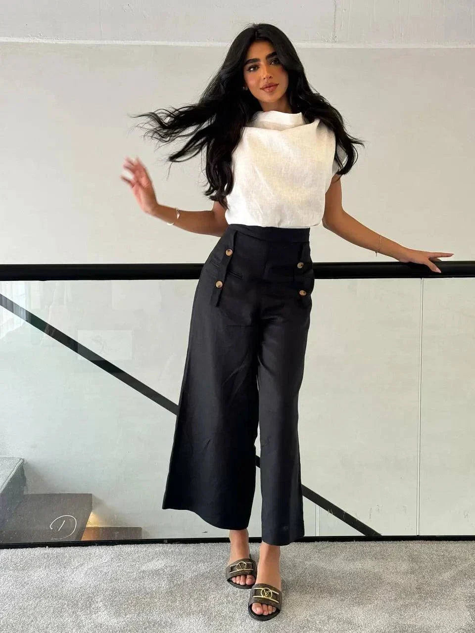 Woman wearing a white linen blouse with a unique collar design paired with high-waisted black pants - Blouse Linen White