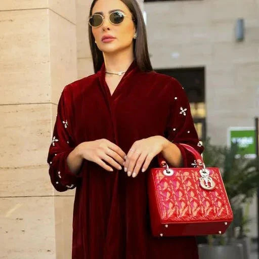luxurious maroon velvet abaya with delicate sleeve embroidery and elegant texture
