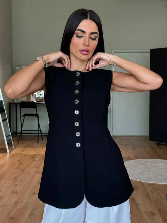 Black sleeveless vest in crepe fabric with front buttons, styled for layering over dresses or abayas.