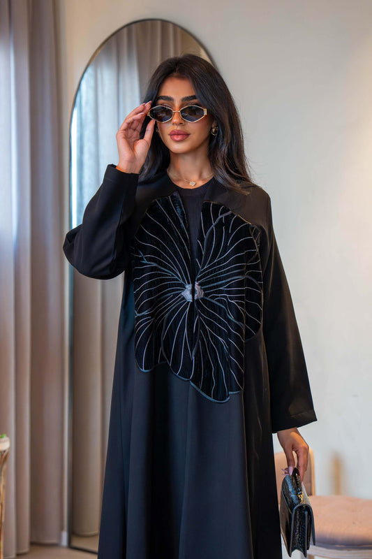 Classic black crepe abaya with velvet flower detail on front and simple silhouette