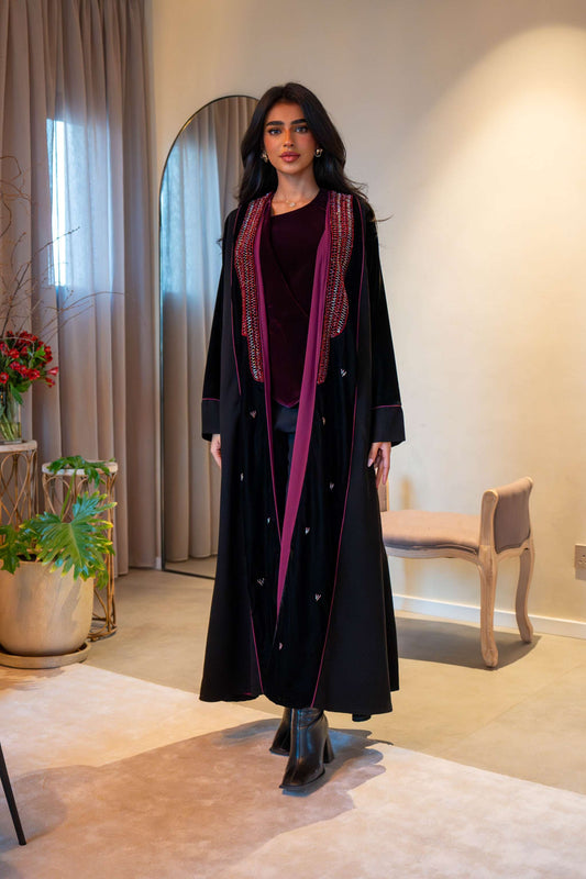 Elegant black velvet abaya with red embroidered trim and soft chiffon lining for comfort and flow