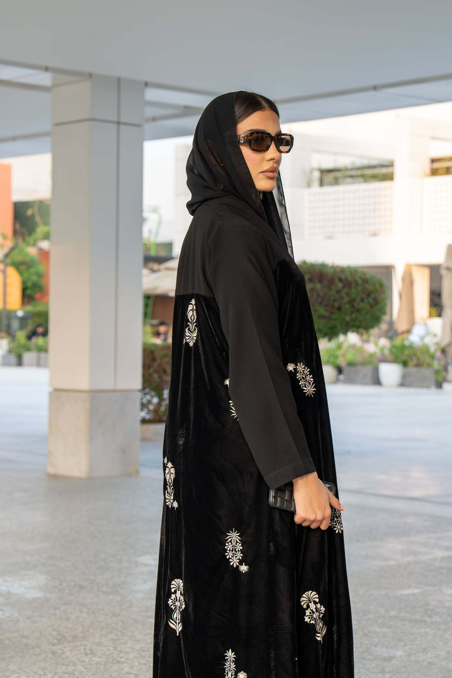 Black Velvet Bloom abaya with elegant embroidery and loose bisht-style cut, combining velvet and crepe fabrics for a luxurious look