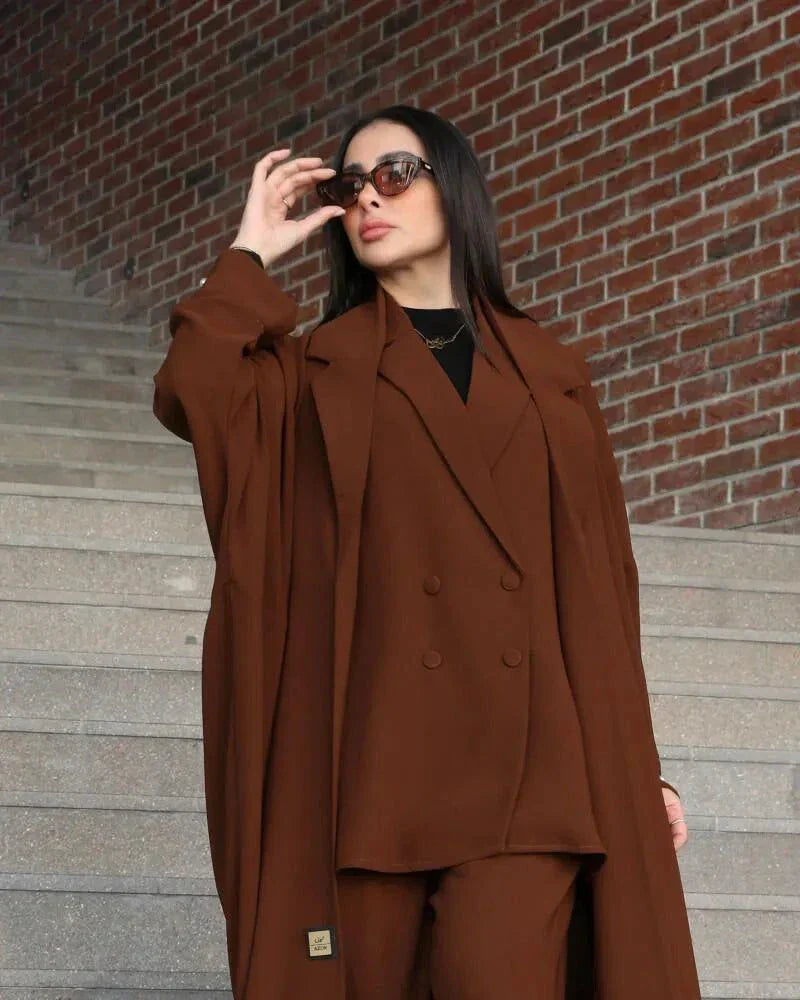Woman wearing a freesize auburn blazer abaya in deep brown crepe with a structured, comfortable fit and double-breasted front.