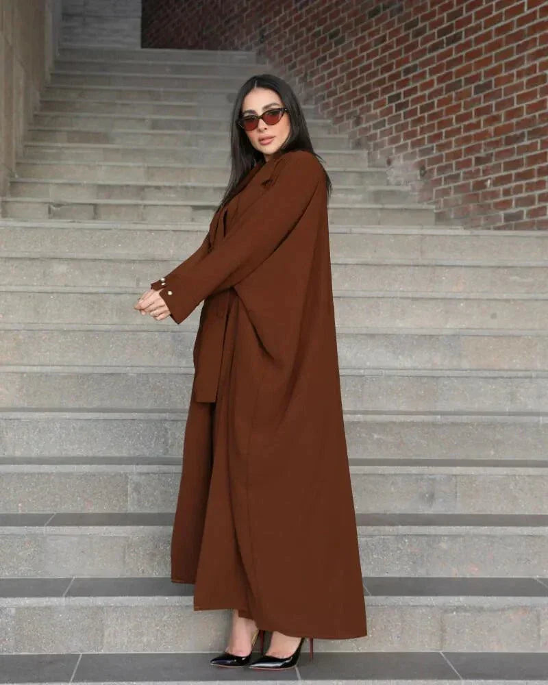 Woman wearing a freesize auburn blazer abaya in deep brown crepe with a structured, comfortable fit and double-breasted front.