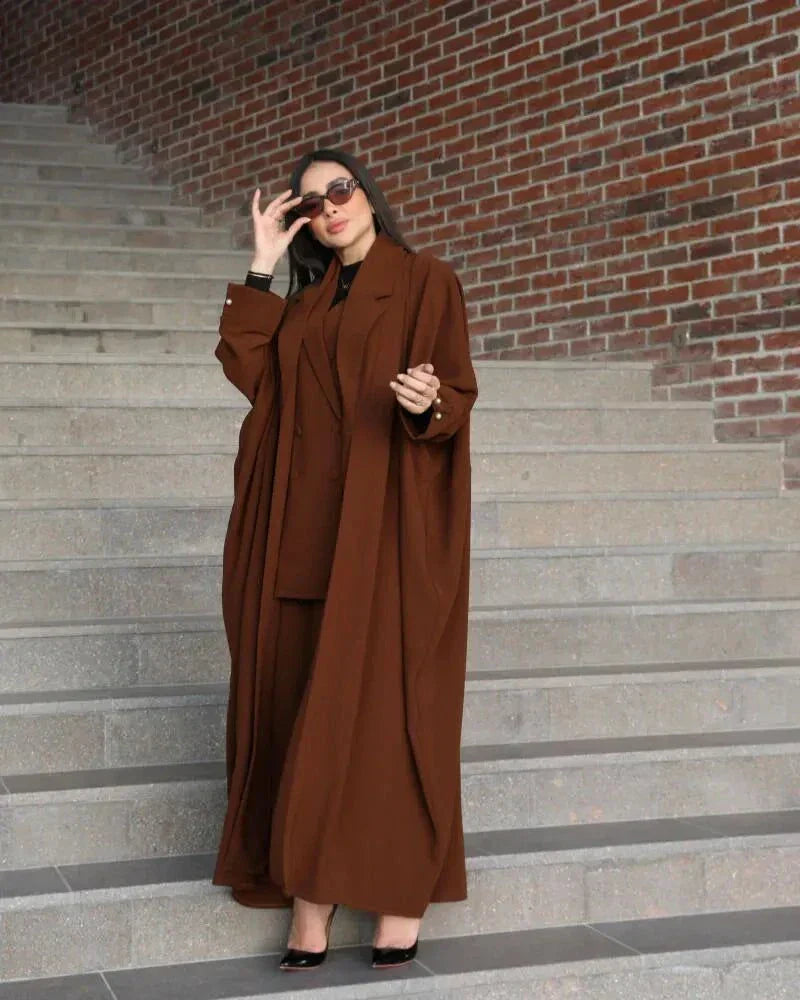 Woman wearing a freesize auburn blazer abaya in deep brown crepe with a structured, comfortable fit and double-breasted front.