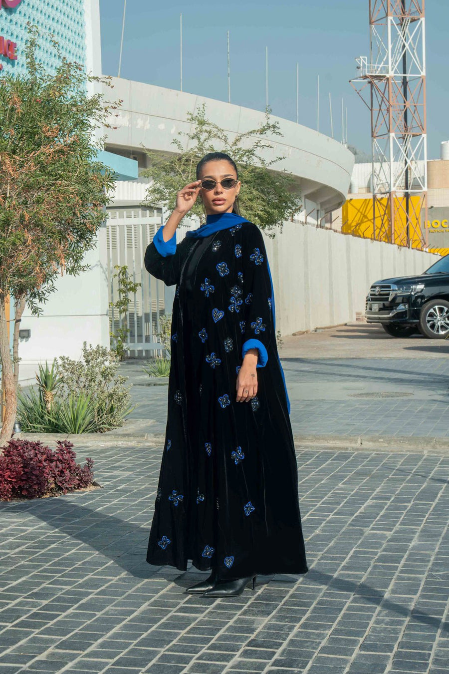 luxurious black velvet abaya with blue floral embroidery and royal blue cuffs with chiffon inner scarf