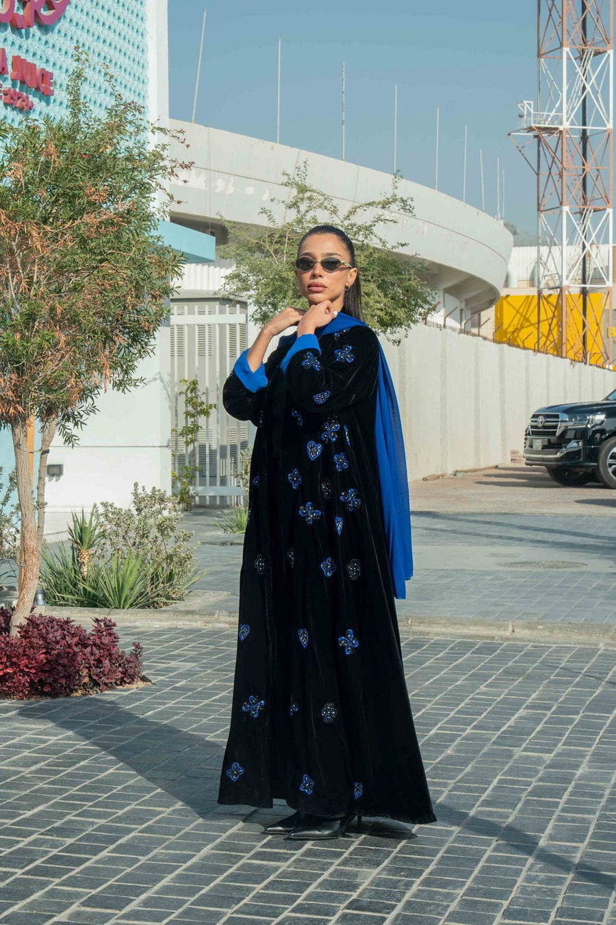luxurious black velvet abaya with blue floral embroidery and royal blue cuffs with chiffon inner scarf
