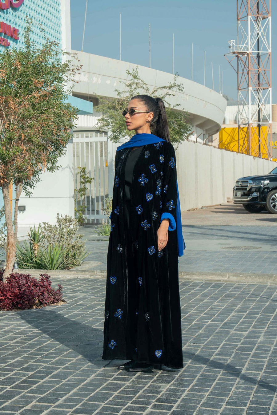 luxurious black velvet abaya with blue floral embroidery and royal blue cuffs with chiffon inner scarf