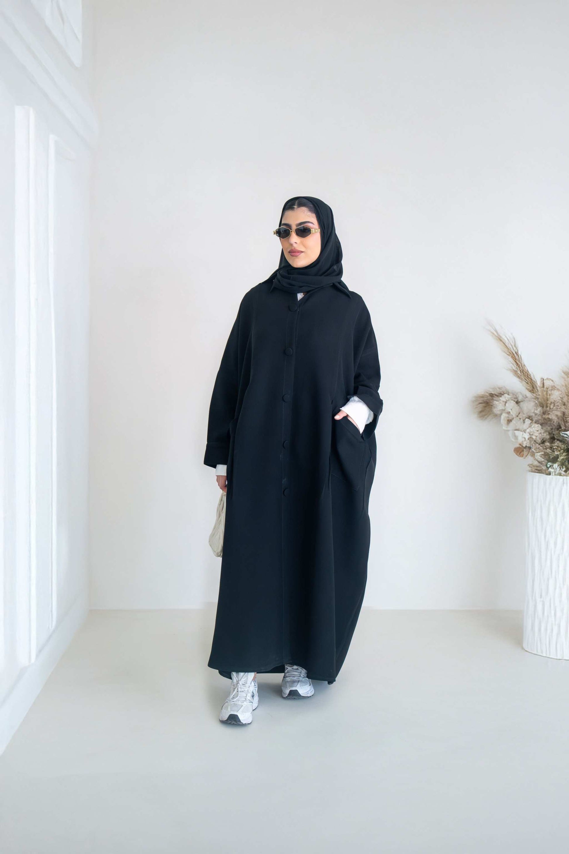 luxurious black crepe abaya with loose fit and elegant design for formal and everyday wear