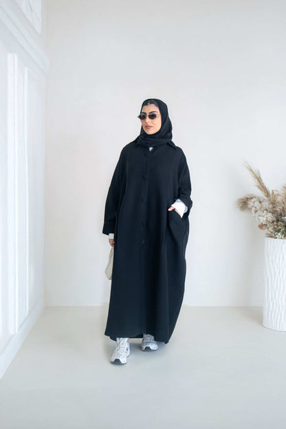 luxurious black crepe abaya with loose fit and elegant design for formal and everyday wear