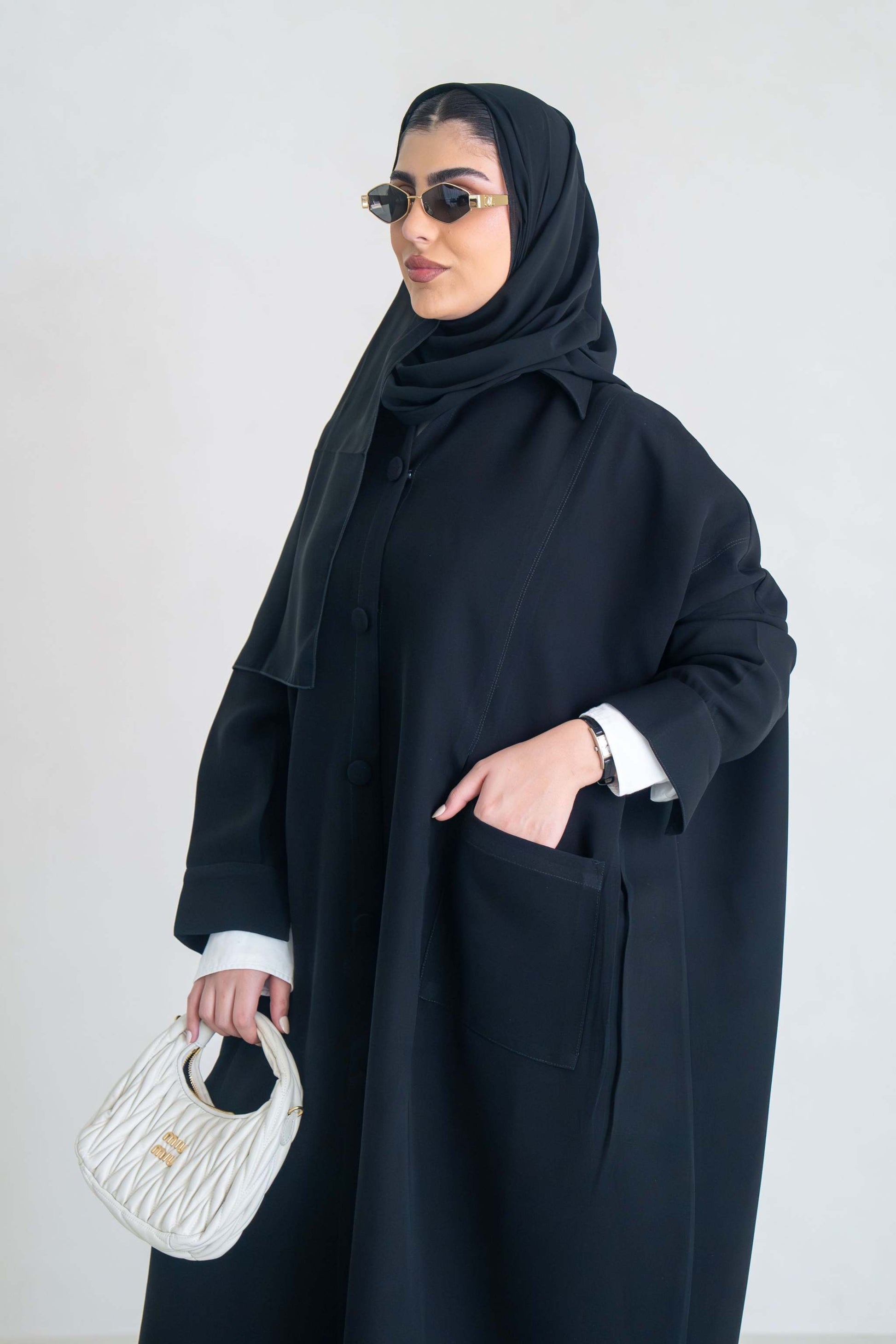 luxurious black crepe abaya with loose fit and elegant design for formal and everyday wear
