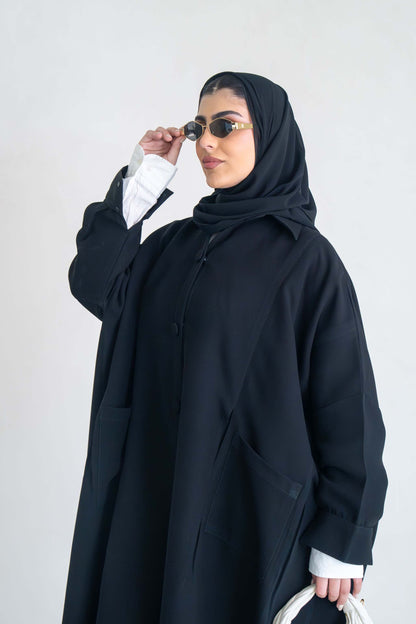 luxurious black crepe abaya with loose fit and elegant design for formal and everyday wear
