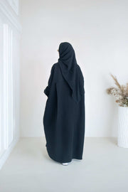 luxurious black crepe abaya with loose fit and elegant design for formal and everyday wear